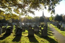 Bereaved families are waiting to find out whether the graves of their loved ones will be built over for a church extension.
