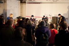 A local gallery has re-opened its doors as a venue for live music after it was forced to cease its live events after a row over noise levels.