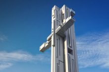 Controversial plans for a new 'crucifix' design skyscraper in the city have been defended by its creator.