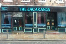Two university students are attempting to keep the memory of the famous Liverpool Jacaranda bar alive, despite its closure.