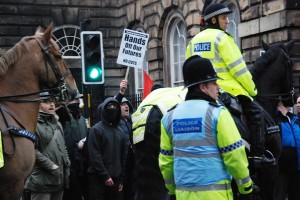 Protesters eye up the Police