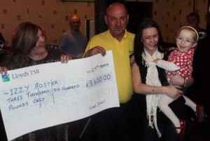 Izzy Foster with mum Annie receiving their cheque