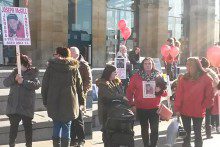 Human rights campaigners protested outside Lime Street station against a controversial law.