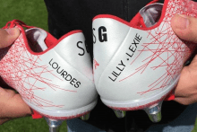 A pair of limited edition football boots marking Steven Gerrard’s time at Liverpool were auctioned for £40,200.