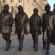 A new bronze statue of The Beatles has been unveiled on Liverpool's waterfront by John Lennon’s sister, Julia Baird.