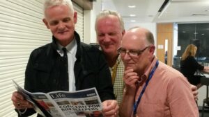 ITN Managing Editor Robin Elias reads our Liverpool Life Newspaper with lecturers Richard Rudin and Steve Harrison at the LSS Graduation Show. Pic © JMU Journalism