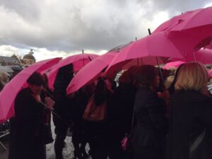 Pink umbrellas were the order of the day at Herbert Howe's funeral. Pic by Laura Hughes © JMU Journalism