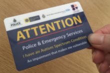 A special needs charity has collaborated with Merseyside Police to create the autism attention card.