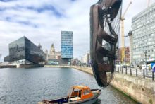 A humungous sandal hangs suspended over Canning Dock and more curious sights are appearing ahead of the Giants' arrival.