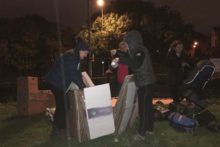 More than 100 people slept outside all night in atrocious conditions to help the city's homeless.