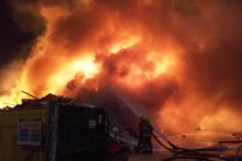 Emergency services battled overnight to contain a large fire at a Birkenhead recycling centre.