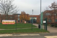 A Wirral high school is banning pupils from wearing designer branded coats in a bid to prevent the bullying of pupils without them.