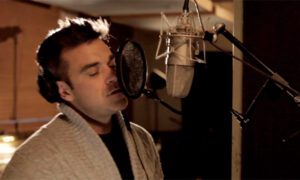 Robbie Williams appears on the Hillsborough charity single © The Justice Collective