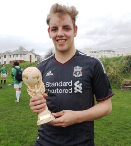 Josh Weale holds the JMU Journalism World Cup after scoring the only goal of the 2014 final