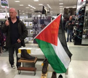 Pro-Palestinian protester in the Liverpool Debenhams store. Pic © JMU Journalism