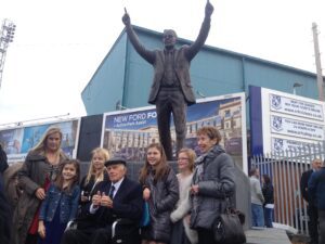 Thumbs up: Johnny King and his family infront of the new statue
