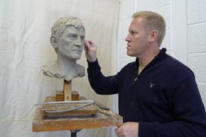 Steven at work on the Kenny Dalglish sculpture. Pic © Steven Hunter