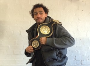 Courtney Fry holding up one of his boxing titles. Pic by Anthony Fisher © JMU Journalism