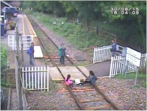 Matlock Bath - Children sit on rails while mother takes picture © Network Rail