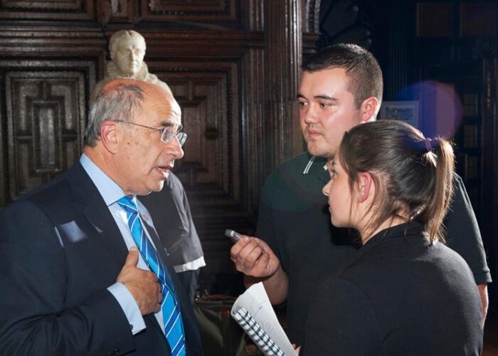 JMU Journalism students Christy Jade Biggar (left) and James Knowles (right) with Chancellor Sir Brian Leveson (centre). Pic © LJMU