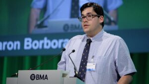 Doctor Aaron Borbora giving his speech at a British Medical Association meeting. © BMA