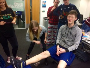 Leigh Kimmins endures a leg-waxing to raise money for Macmillan Cancer Support on JMU Journalism Christmas Jumpers Newsdays 2015