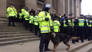 Police forming ring around protesters. Pic by Leigh Kimmins © JMU Journalism