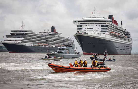 The New Brighton RNLI escorts the Three Queens into the River Mersey last May. Pic © Bob Warwick, RNLI