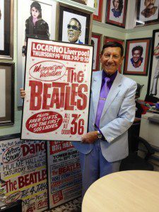 Tony Booth holding one of his Beatles posters. Pic © Tony Booth