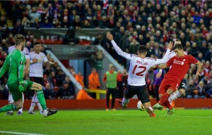 Roberto Firmino scores for Liverpool from the penalty spot against Manchester United. Pic © David Rawcliffe / Propaganda Photo