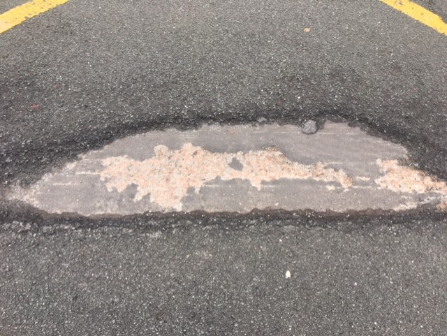 Huge pothole in the middle of the road - JMU Journalism