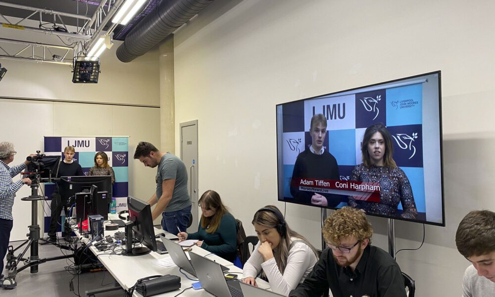 Third year JMU Journalism students taking part in a live newsday in from of LJMU's board of governors in the John Lennon Art and Design Building.