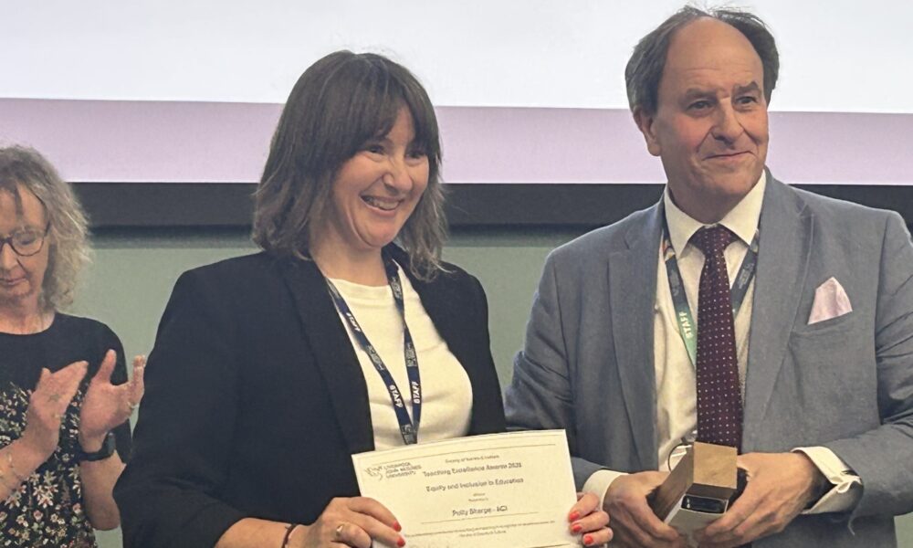 Polly Sharpe receives the LJMU Faculty of Society and Culture Award from Pro-Vice-Chancellor, Timothy Nichol
