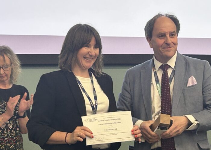 Polly Sharpe receives the LJMU Faculty of Society and Culture Award from Pro-Vice-Chancellor, Timothy Nichol