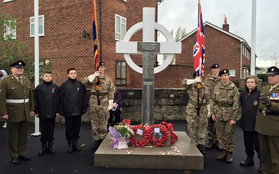 Major Sam Adams (far right) and cadets stand near the new cenotaph memorial. Pic by Christy Jade Biggar © JMU Journalism