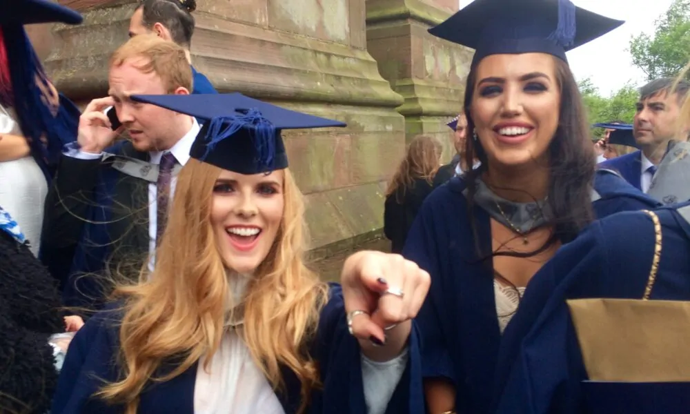 All smiles for Amber Pritchard and Stephanie Sweeney on graduation day - JMU Journalism